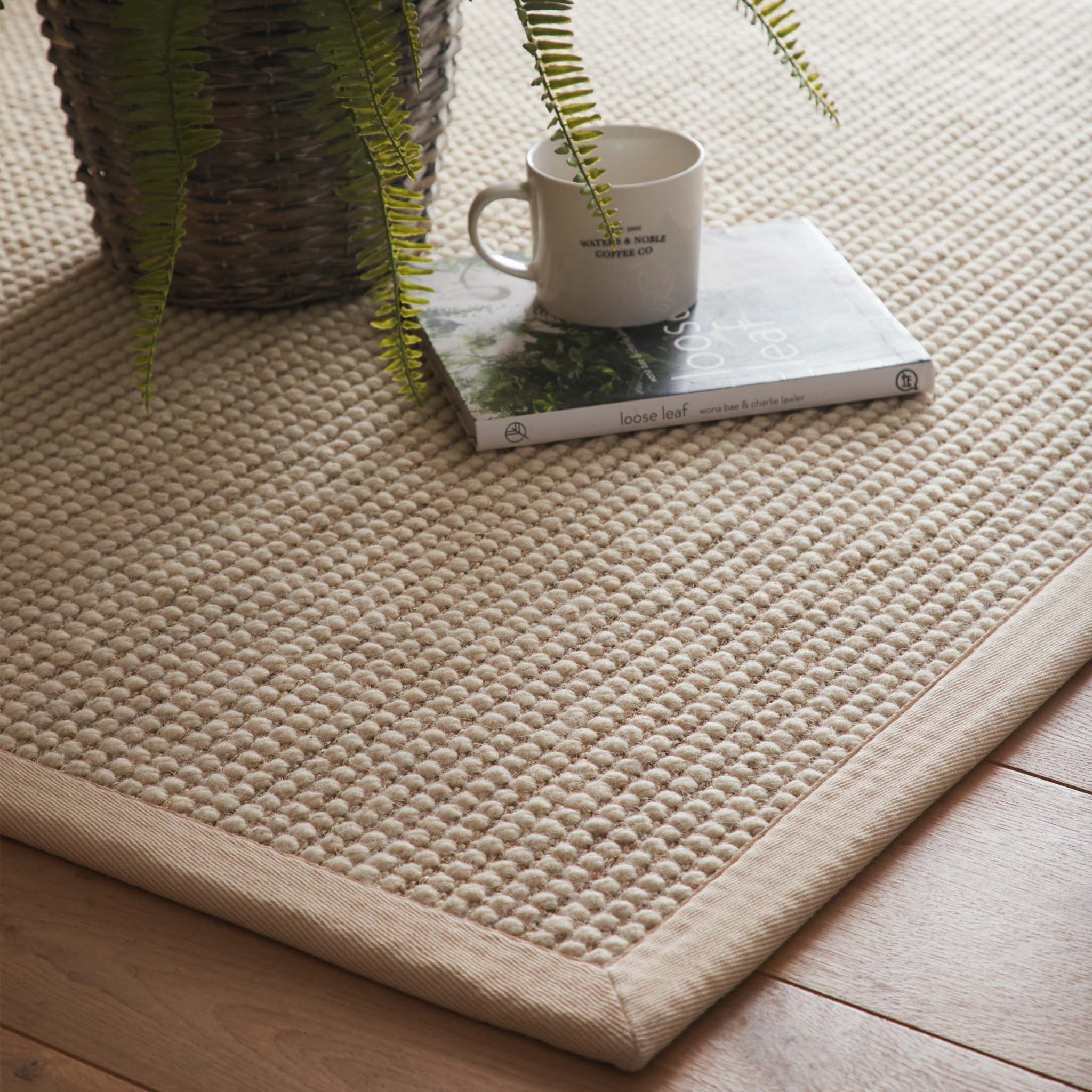 Origins Sisal Boucle with Beige Border- a wool rug featuring a natural border. 