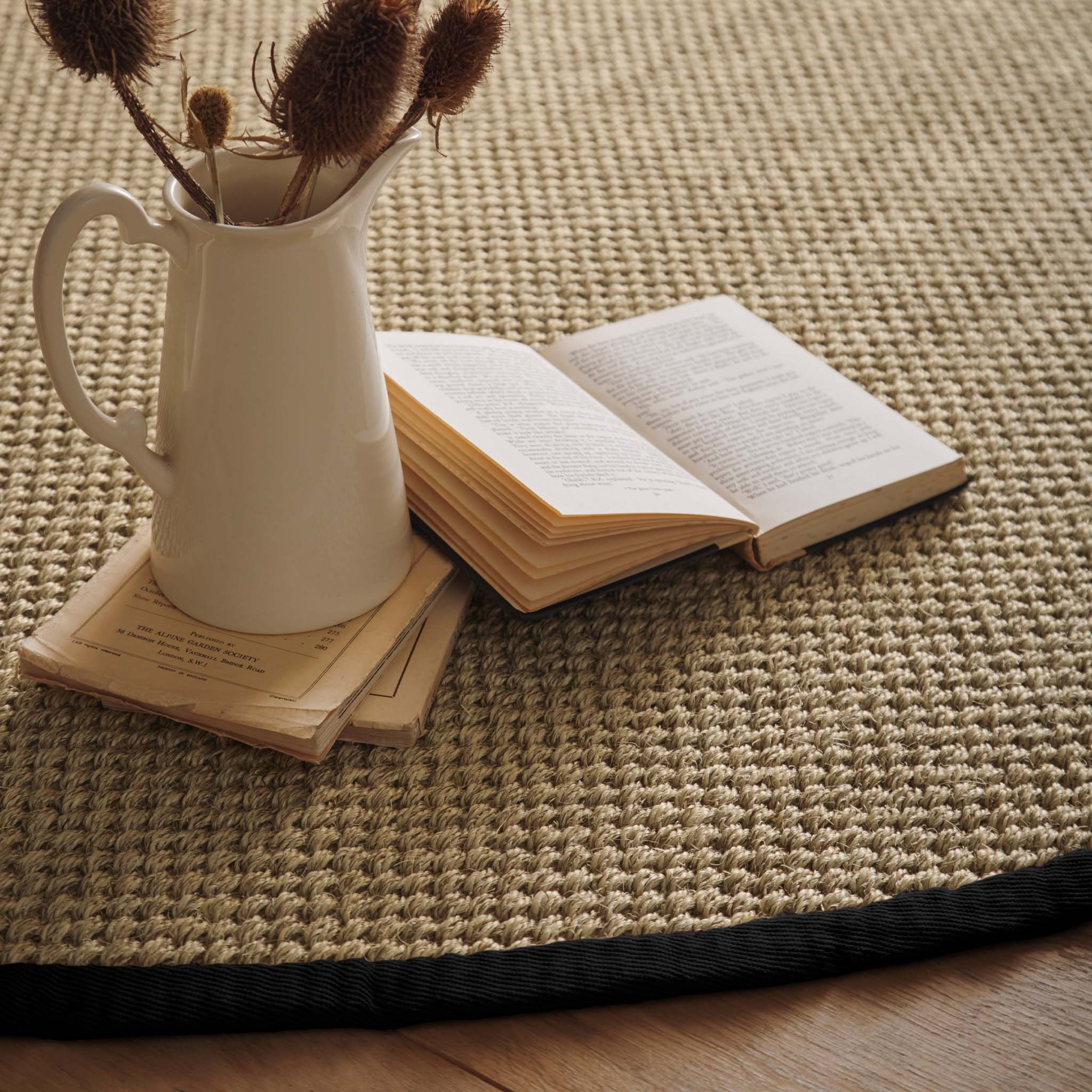 Origins Sisal Light Beige with Black Border- made from 100% sisal featuring a black border.