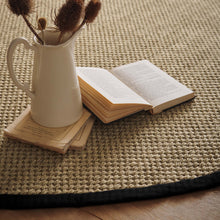 Load image into Gallery viewer, Origins Sisal Light Beige with Black Border- made from 100% sisal featuring a black border.
