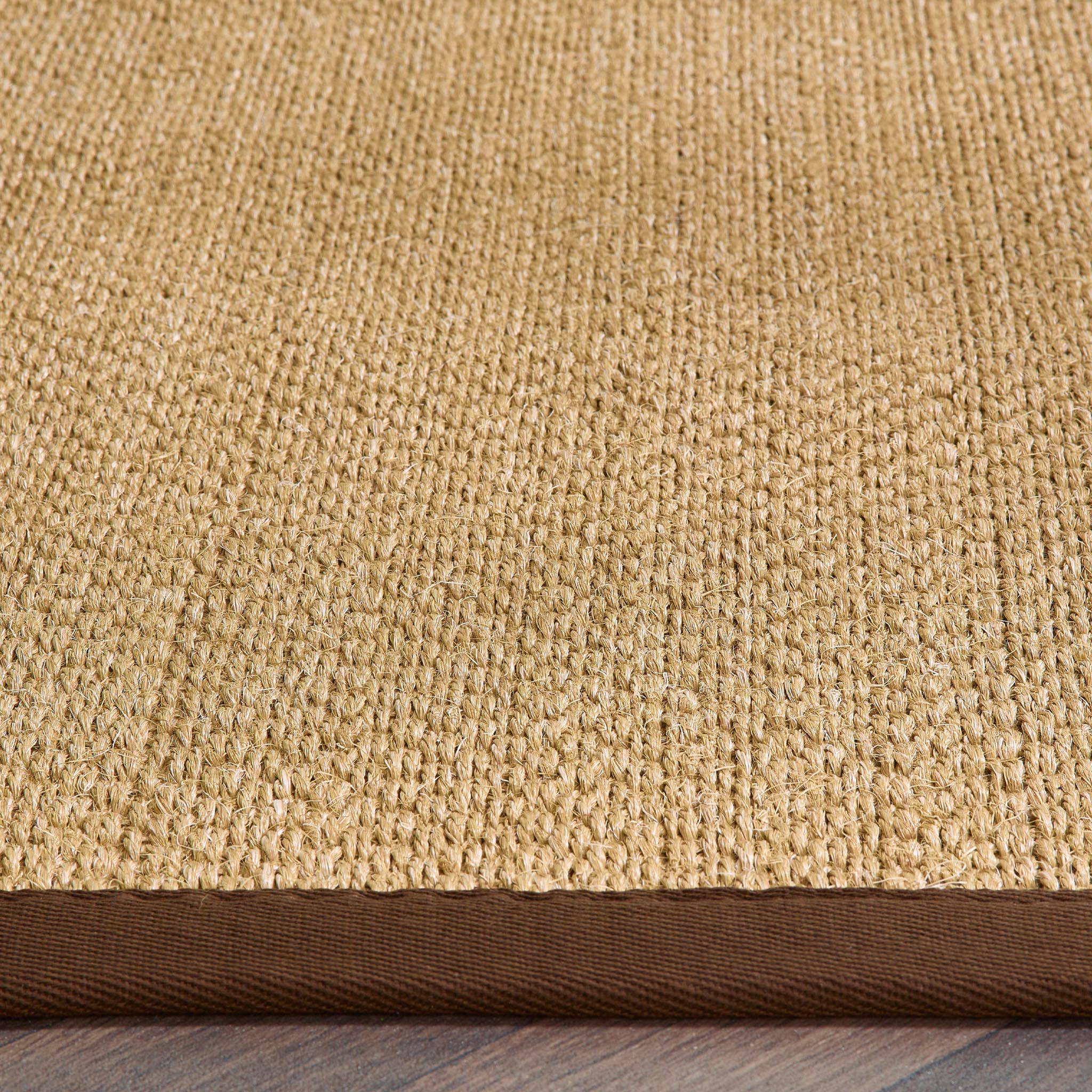 Origins Sisal Warm Natural with Dark Brown Border- a natural rug made from 100% sisal featuring a brown border.
