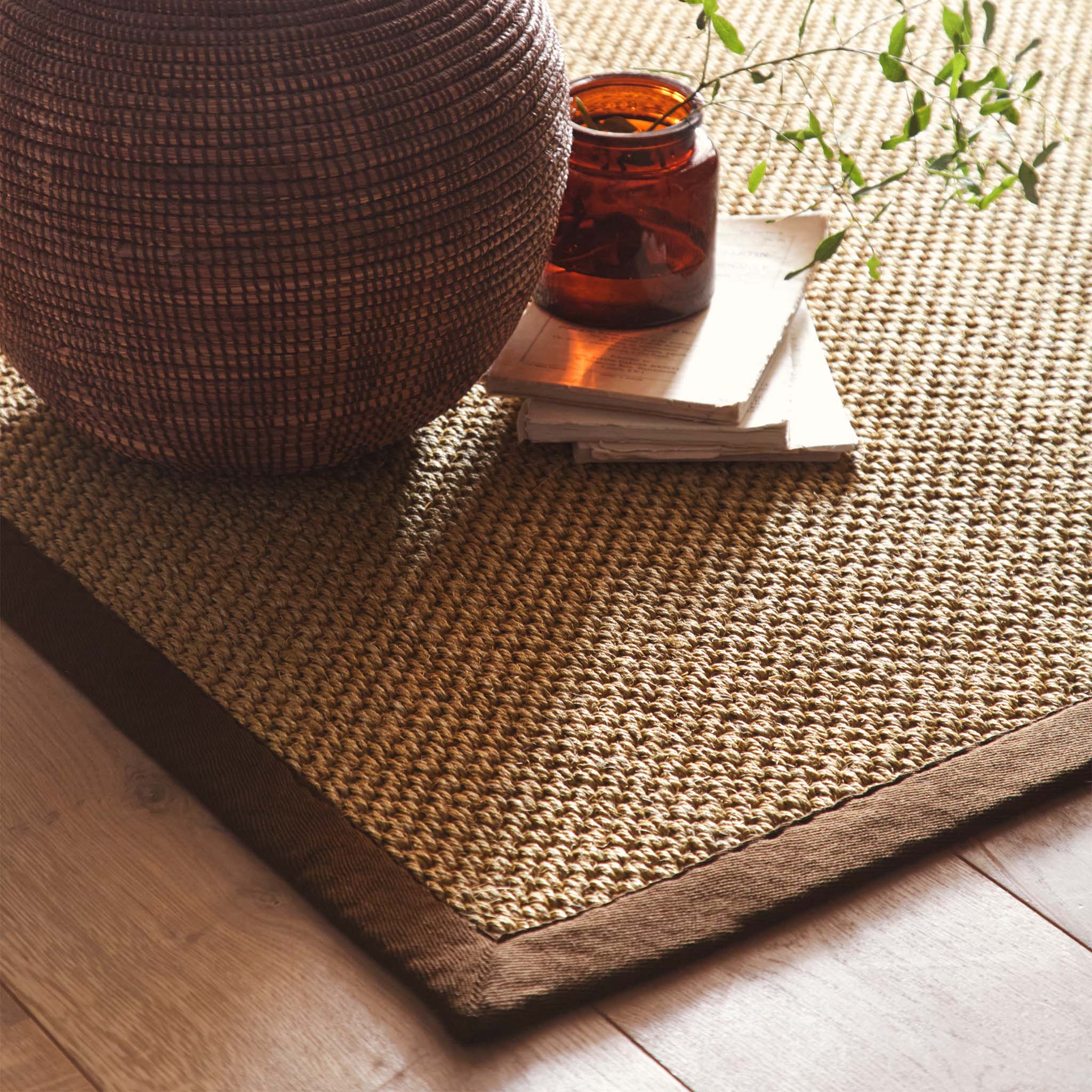 Origins Sisal Warm Natural with Dark Brown Border- a natural rug made from 100% sisal featuring a brown border.